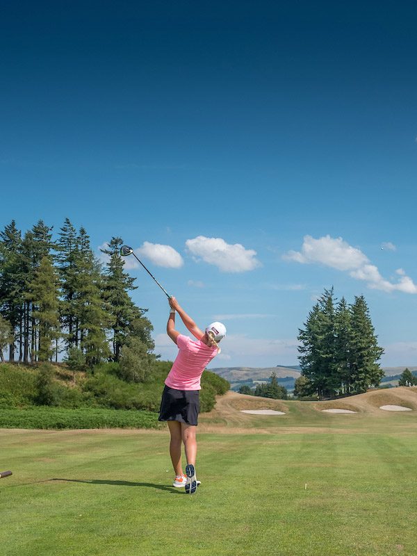 Golfer on a sunlit tee